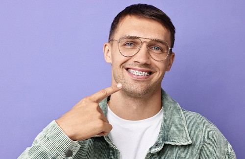 a patient with braces smiling