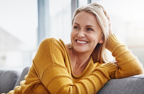 a woman relaxing with a healthy smile