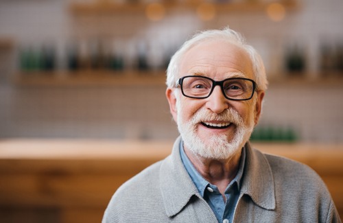 Close-up of bearded senior man smiling