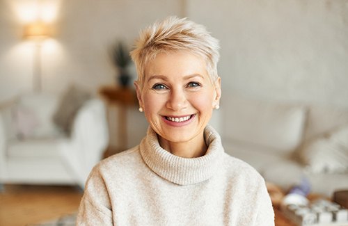 Senior woman in sweater smiling